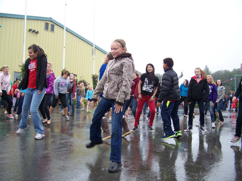 Students of Vergine’s Dance Studio surprise the crowd with a flash mob performance of “Gangnam Style.”-Photo by McKibben Jackinsky, Homer News
