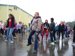 Students of Vergine’s Dance Studio surprise the crowd with a flash mob performance of “Gangnam Style.”-Photo by McKibben Jackinsky, Homer News