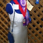 In addition to multiple ribbons, the gray and white brocade evening gown sewn by Linda Lempe of Homer was described by judges as "lovely."-Photo by McKibben Jackinsky, Homer News