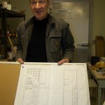 Mike Warburton reviews plans for a new restaurant.-Photo by McKibben Jackinsky, Homer News