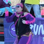 Maria Santa Lucia dances through the streets with the Zumba parade float on Saturday.-Photo by McKibben Jackinsky, Homer News