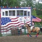 Ninilchik rodeo family camaraderie is evident in each event, whether it’s a young cowboy experiencing the thrill of calf riding, a bull rider trying to hang on for eight seconds, or the two-member teams in the roping competitions.-Photo by McKibben Jackinsky, Homer News