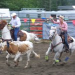 Ninilchik rodeo family camaraderie is evident in each event, whether it’s a young cowboy experiencing the thrill of calf riding, a bull rider trying to hang on for eight seconds, or the two-member teams in the roping competitions.-Photo by McKibben Jackinsky, Homer News