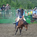 Ninilchik rodeo family camaraderie is evident in each event, whether it’s a young cowboy experiencing the thrill of calf riding, a bull rider trying to hang on for eight seconds, or the two-member teams in the roping competitions.-Photo by McKibben Jackinsky, Homer News
