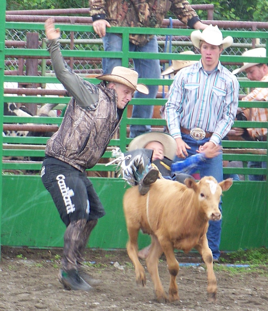 Ninilchik rodeo family camaraderie is evident in each event, whether it’s a young cowboy experiencing the thrill of calf riding, a bull rider trying to hang on for eight seconds, or the two-member teams in the roping competitions.-Photo by McKibben Jackinsky, Homer News