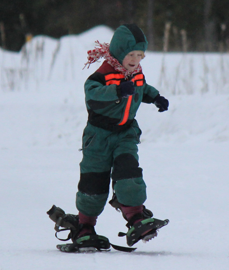 Lydia Coe races to the finish of the snowshoe portion of the biathlon.-Photo by McKibben Jackinsky, Homer News