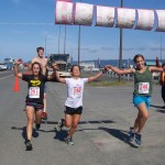 The first women to finish in today's 10K Run for the Bay Homer Spit Run are, from left, Molly Mitchell, Barae Hirsch and Aurora Waclawski. They finished with a time of 43:30-McKibben Jackinsky