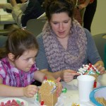 Charity Rainwater, 5, and her Aunt Deana Moyer, both of Homer, put their construction skills to work.  -McKibben Jackinsky,  Homer News