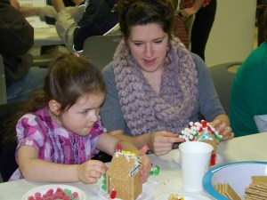 Charity Rainwater, 5, and her Aunt Deana Moyer, both of Homer, put their construction skills to work.  -McKibben Jackinsky,  Homer News
