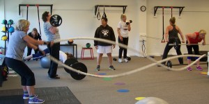 At the Alaska Training Room, owner Mary Jo Cambridge, center, offers a corporate membership for her supervised circuit training as one more way to encourage  wellness. At the Bay Club, owner Kellie Blue offers a similar program. -Photo by McKibben Jackinsky, Homer News