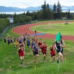 Varsity boys tackle the uphill portion of Friday’s Homer Invite cross country course, with Nikolaevsk’s Greg Trail in the lead.-Photo by McKibben Jackinsky, Homer News