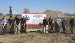 Many involved in the process to secure funding for a new home for Ninilchik Emergency Services break ground on the project in a ceremony Saturday morning. From left are Konrad Jackson, assistant to Rep. Kurt Olson; Rep. Paul Seaton; Dr. Roy Boone, a Ninilchik Emergency Services board member; Mike Chihuly, fire chief of Ninilchik Emergency Services; Sen. Peter Micciche; Rep. Mike Chenault; Willard Bowman, a Ninilchik Emergency Services board member; Gina Wiste, EMS chief of Ninilchik Emergency Services; and Steve Vanek, a Ninilchik Emergency Services board member.-Photo provided