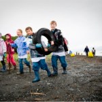 children collect trash at an earlier CoastWalk cleanup. -Provided
