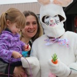 Jillian Koran, 3, and her mom, Malisa Levenson, visit with the special guest at the American Legion’s Easter Egg Hunt.-McKibben Jackinsky