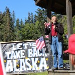 Vic Fischer of the Vote Yes! Repeal the Giveaway group speaks at Saturday’s rally in Homer.-Photo by McKibben Jackinsky, Homer News