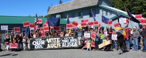 Supporters of Ballot Measure 1 end Saturday’s rally with a march down Pioneer Avenue to the Legislative Information Office. -Photo by McKibben Jackinsky, Homer News