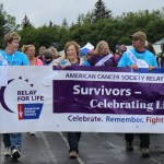 Tammy Ackerman, Ginger VanWagoner, Rick and Tanya Norvell lead the cancer-survivor lap of Homer Middle Schoool track on Friday, officially launching the 2014 Relay for Life of Homer.-Photo by McKibben Jackinsky, Homer News