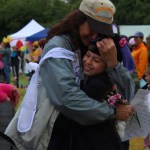 Cancer survivor Pam Augustine of Kittanning, Pa., gets a hug from her niece Delilah Harris of Homer on Friday at the Relay for Life of Homer. -Photo by McKibben Jackinsky, Homer News