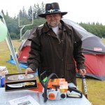 Fred Eddy, a cancer survivor, of Anchor Point displays items his Relay for Life team raffled to help raise funds for the American Cancer Society. -Photo by McKibben Jackinsky, Homer News