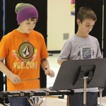 Musicians Phin Weston and Clayton Beachy play “Bells Medley”-Photo by McKibben Jackinsky, Homer News