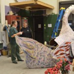 Steve Krause and Bobby Copeland-McKinney discuss repairs to the Nutcracker’s swan. Over 100 volunteers worked on the show. -Photo by Annie Rosenthal, Homer News