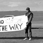 Protesters hold signs along the Homer Spit during meetings involving Exxon in the months after the spill.   -File photo