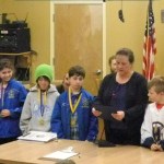 Homer Mayor Beth Wythe reads a proclamation honoring the Homer Glacier Kings Squirts hockey team state champions at the Homer City Council meeting on Monday. Honored were team members, in no order, Rachel Bolin, Terry Gilliland, Hunter Green, Delilah Harris, Timothy Hatfield, Fiona Hatton, Dylan McBride, Tobias “Jack” Nevak, Casey Otis, Haylee Owen, Kazden Stineff, Keegan Strong, Micah Williamson, head coach Chris Owen and assistant coaches Dave Bolin and Travis Larson.                                                        -Michael Armstrong-Homer News