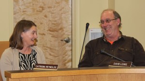 Homer’s newest city council member, Catriona Reynolds, takes her place at the council table after being sworn in during a special meeting of the council Monday. Reynolds is seated next to David Lewis, who won re-election Oct. 7, and also was sworn in at the Monday meeting, as was Beth Wythe, who won re-election as the city’s mayor.-Photo by McKibben Jackinsky, Homer News