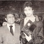 Head coach Steve Wolfe poses with outstanding wrestler and state champion, Ian Pitzman, in 1986. PItzman pinned all three opponents at the state meet.-Homer News file photo