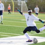 Nouredine Mama winds up to kick the ball across the field, away from Colony players, during the May 6 home game. -Photo by Anna Frost; Homer News