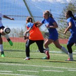 Kaela Jiron blocks a Palmer goal attempt in a single leap during the Mariners May 7 home game against Palmer.-Photo by Anna Frost, Homer News