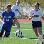 Mariah Vantrease rushes to take the ball away from a Palmer player during the girls varsity game at Homer High on Saturday, May 7.-Photo by Anna Frost; Homer News