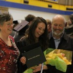 Valedictorian Shannon Reid laughs as she takes photos with her parents Linda and Ian Reid at the reception after the Kachemak Bay Campus of Kenai Peninsula College graduation ceremony on May 4.-Photo by Anna Frost, Homer News