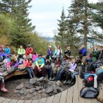 Tristan Arnold, Bay Bloom, Katharine Bramante,  Patrick Collinson, Kobe Curry, Ella Czarnezki, Maleda Denbrock, Indyra Edwards-Smith, Myles Evarts, Willow Kitchens,  Molly Koski, Hannah Leaders, Isaiah Maal,  Scott Michael,  Sonia Montague, Grayden Musgrave, Morgan Noyes, Selena Payment, Ayden See, Thomas Snow, William Stang, Jordan Strausbaugh, and Zane Tews list off names of the creatures they found in the tide pools to the Peterson Field Station naturalists (not pictured). The group is teacher Terri Carter's fourth, fifth and sixth grade class from Soldotna Montessori.