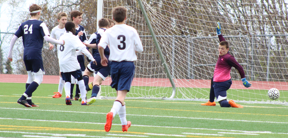 Homer and Soldotna players as the ball flies past Soldotna's goalie on a kick from Nouredine Mama. Homer lost by one point in the Tuesday, April 19 game against Soldotna.-Photo by Anna Frost; Homer News