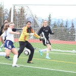 Uliana Reutov takes a shot at Nikiski's goal during the Thursday, April 14 game held at Homer High. Homer finished 4-0 against Nikiski, earning their first win at home.-Photo by Anna Frost; Homer News