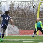 Sam Draves crouches slightly in preparation to catch a ball kicked toward the Homer goal by a Soldotna player. Homer girls played Soldotna on Tuesday, April 19 at Homer High, losing 3-0.-Photo by Anna Frost; Homer News