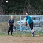 PK Woo throws the ball across the field during a throwing and catching drill at practice. The varsity softball team will play their first game of the season against Kenai Central High School on Tuesday, April 26.-Photo by Anna Frost; Homer News