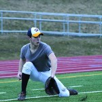 Kyle Johnson kneels down to catch a grounder during practice. The baseball team has been preparing for the start of their season since early March.-Photo by Anna Frost; Homer News
