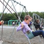 Daniel Kulikov works on his swinging form during recess on the first day of school at West Homer Elementary, on Tuesday, Aug. 21, 2018 at the school in Homer, Alaska. (Photo by Megan Pacer/Homer News)