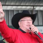 Auctioneer Andy Kriner keeps track of bidders during the 4-H JML auction Saturday, Aug. 18, 2018 at the Kenai Peninsula Fair in Ninilchik, Alaska. (Photo by Megan Pacer/Homer News)