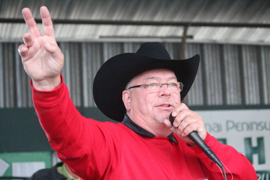 Auctioneer Andy Kriner keeps track of bidders during the 4-H JML auction Saturday, Aug. 18, 2018 at the Kenai Peninsula Fair in Ninilchik, Alaska. (Photo by Megan Pacer/Homer News)