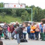 A man launches a salmon into the air during the fish toss, and even held during the annual Kenai Peninsula Fair, on Saturday, Aug. 18, 2018 at the fairgrounds in Ninilchik, Alaska. (Photo by Megan Pacer/Homer News)