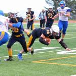 Homer junior Noah Fisk heads toward the ground after running the ball for the Mariners during their Saturday, Aug. 25, 2018 game against Monroe Catholic High School in Homer, Alaska. The Rams came out victorious, beating Homer 28-27. (Photo by Megan Pacer/Homer News)
