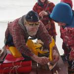 John Miles, left, helps Ike Mitchell work on a boat during the Kachemak Bay Wooden Boat Society Festival on Saturday, Sept. 2, 2017 at the Nick Dudiak Fishing Lagoon campground in Homer, Alaska. Ikes mother, Jamey Cloud, and his brother, Charlie Mitchell, watch. (File photo by Michael Armstrong/Homer News)