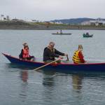 Charlie Barnwell, center, takes Anna Morphis and Richard Morphis for a boat ride during the Kachemak Bay Wooden Boat Society Festival on Saturday, Sept. 2, 2017 at the Nick Dudiak Fishing Lagoon campground in Homer, Alaska. (File photo by Michael Armstrong/Homer News)