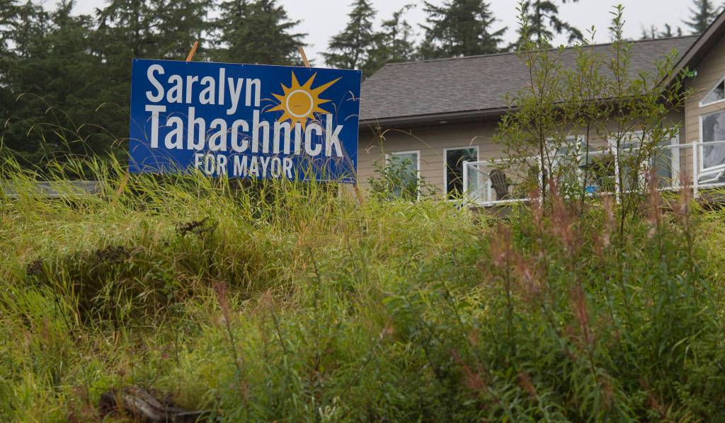 A Saralyn Tabachnick for mayor election sign on Mendenhall Loop Road on Friday, Aug. 24, 2018. Alaska statute states signs on private or commercial property cannot be located within 660 feet of a state-maintained road or with the purpose of their message being read from the main traveled way. (Michael Penn | Juneau Empire)
