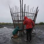 Robin Austin, left, and Natalia Mulawa, right, work on Shine, this years Burning Basket, Tuesday, Sept. 5, 2017 at Mariner Park on the Homer Spit, Alaska. The annual interactive art project will be offered to the community on Sunday and then transformed into heat and light at sunset. (Photo by Michael Armstrong, Homer News)