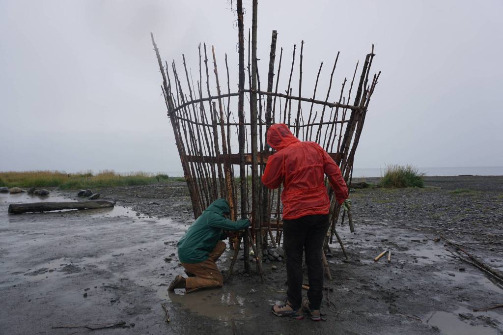 Robin Austin, left, and Natalia Mulawa, right, work on Shine, this years Burning Basket, Tuesday, Sept. 5, 2017 at Mariner Park on the Homer Spit, Alaska. The annual interactive art project will be offered to the community on Sunday and then transformed into heat and light at sunset. (Photo by Michael Armstrong, Homer News)