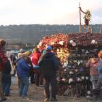Residents gather around this years Burning Basket Project on Sunday, Sept. 10, 2017 in Mariner Park in Homer, Alaska. The 14th annual community art projects theme this year was Shine, and ended with a celebratory burning of the basket and performances by several fire dancers. (Photo by Megan Pacer/Homer News)